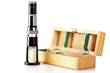 Old fashioned mini microscope and wooden box