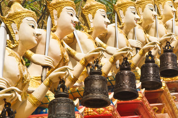 Fototapeta premium Stucco angels with metal bells.