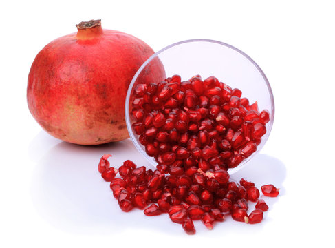 Pomegranate and seeds in a bowl