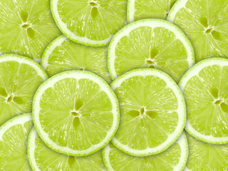 Abstract green background with citrus-fruit of lime slices