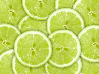 Foto op Plexiglas Abstracte groene achtergrond met citrusvruchten van limoenschijfjes © Boroda