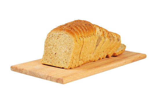 Sliced bread on wooden board