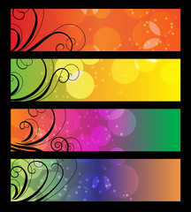 Four many-colored banners with black floral element