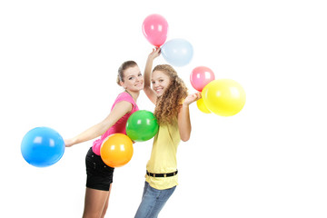 Fototapeta na wymiar two happy girls with balloons over white