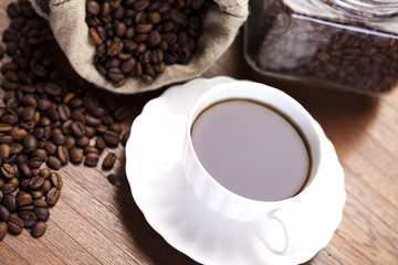 Cup with beans coffee