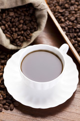 Cup with beans coffee
