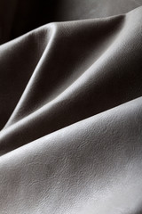 Close-up photo of grey leather ripples