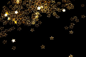 Decoration of golden stars isolated on black
