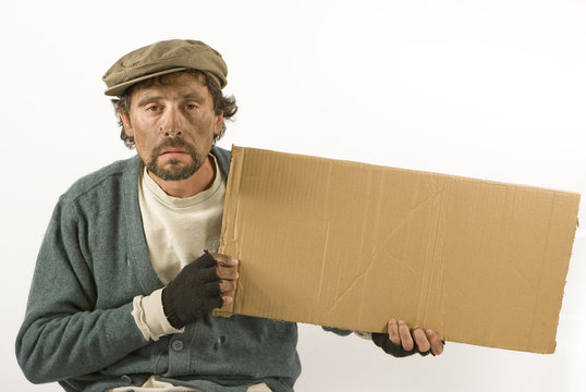 Beggar with cardboard and beret