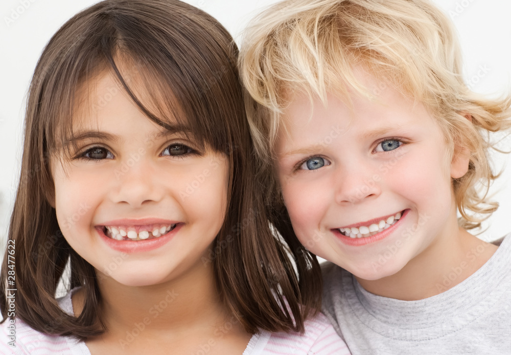 Wall mural Portrait of two happy children in the kitchen