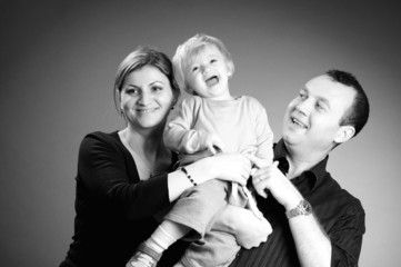 happy family playing in studio