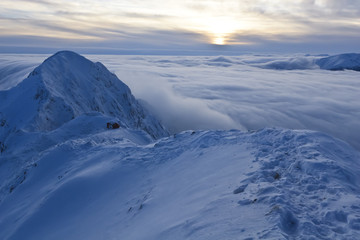 Sunset Over The Mountains And Clouds In Winter