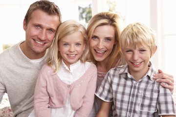 Young family pose together