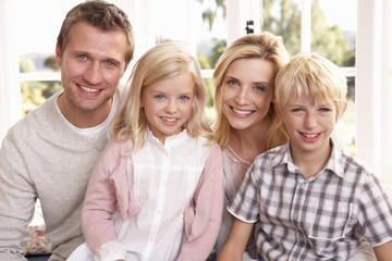 Young family pose together