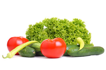 Obraz na płótnie Canvas Fresh tomatoes, cucumbers, paprika and lettuce on white