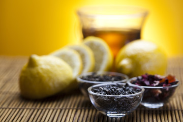 Glass cup of tea with lemon