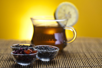 Glass cup of tea with lemon