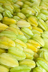 A pile of tropical chinese star fruit, also called carambola gro