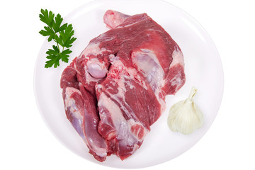 épaule d'agneau cru sur plat