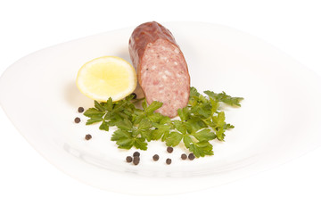 Salami on plate isolated on white background with clipping path
