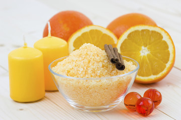 bowl of orange bath salt with fresh fruits - beauty treatment