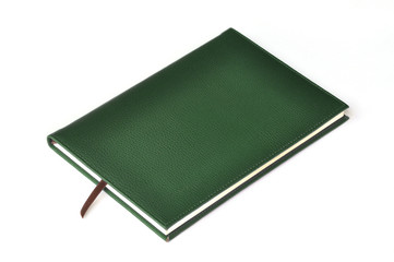 Dark green leather notebook on white background