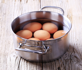 Brown eggs in a pan
