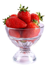 Few strawberries in glass cup isolated on white