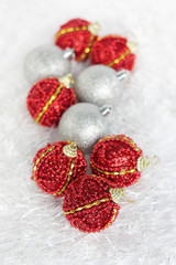 Fototapeta na wymiar Beautiful red and silver christmas balls at shallow DOF