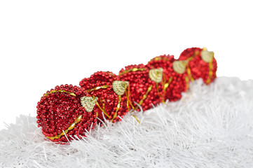 Christmas balls arranged in a row at shallow DOF