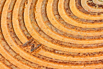 Close up of rusty grange city manhole cover