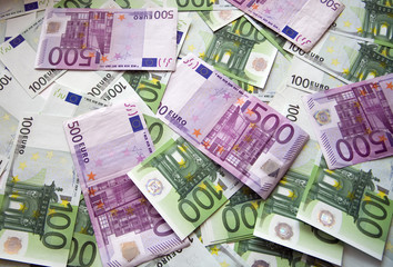 background from chaotically lyings euro banknotes