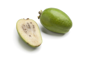 Whole and half fresh feijoa fruit