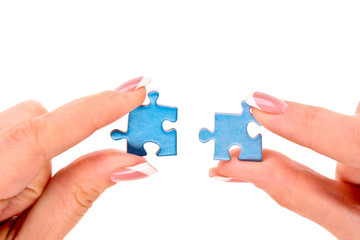 Hands with puzzle isolated on white