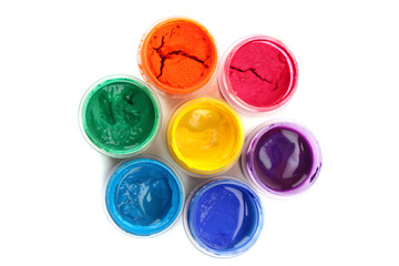 Colorful vibrant cans of gouache isolated on white