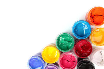 Colorful vibrant cans of gouache isolated on white