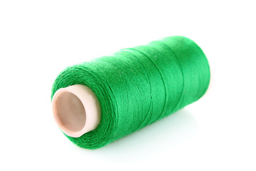 green bobbin thread isolated on white