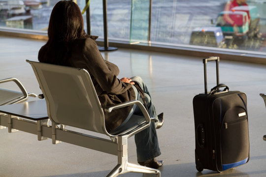 Businesswoman waiting for a plane at airport