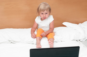 Child looking at laptop screen