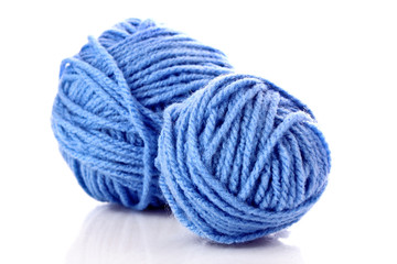 Blue balls of woollen thread isolated on white