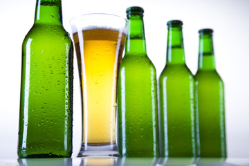Green bottle of beer and glass