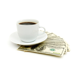 Coffee cup and dollar close up