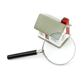 magnifying glass examining model home