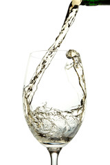 White wine pouring into glass