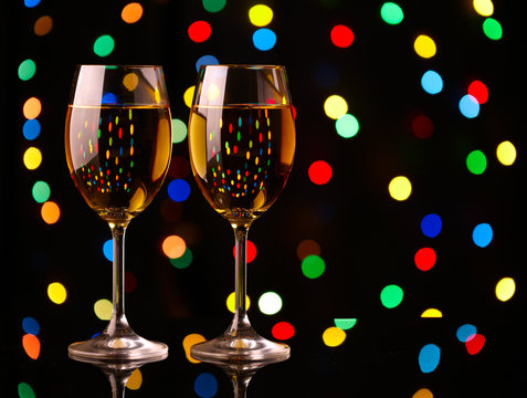 Two wine glasses on holiday background