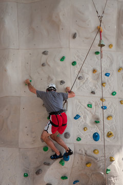 Rock Wall Climber in Red and White Shorts