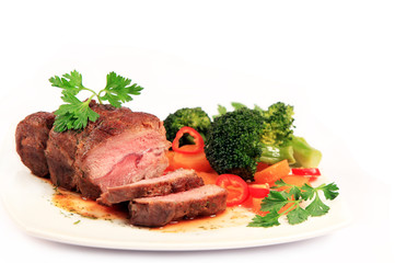 carved roast beef and vegetables