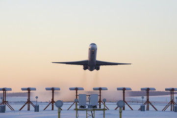 Airplane taking off on a cold december morning