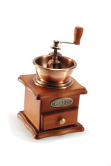 Old copper coffee grinder on white background
