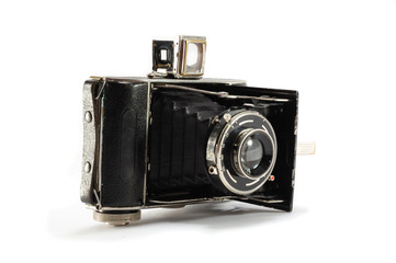 Old film photo camera on white background